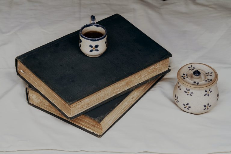 mug on top of stacked books