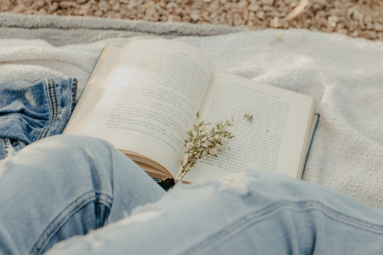 a flower marker on an open book